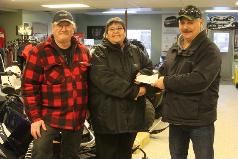 Sissie Beauregard was the big winner of the Border Explorers Snowmobile Club’s annual snowmobile raffle. Beauregard purchased one ticket from the club. Rather than the 2015 Polaris 600 Switchback up for grabs, she decided to take $10,000 and put it towards a planned trip to Niagara Falls. “I just couldn’t believe I won this,” she said, as she picked up her winnings last week. Presenting the prize money to Beauregard were Border Explorers Snowmobile Club president John Trumbley (right) and vice-president Floyd Brown.