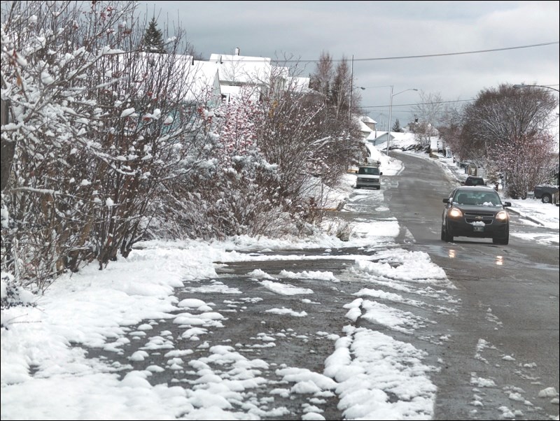 Snow-capped streets, trees and rooftops greeted area residents Monday morning as winter made its arrival. Motorists are reminded to drive with added caution as slush and ice form.