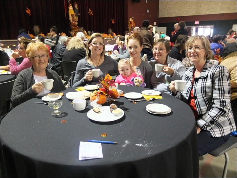 Among those enjoying tea and dainties were (from left) Linda Lautamus, Robyn Garrett, Sara and Piper Pawlachuk, June Reed and Lori Lawrence.