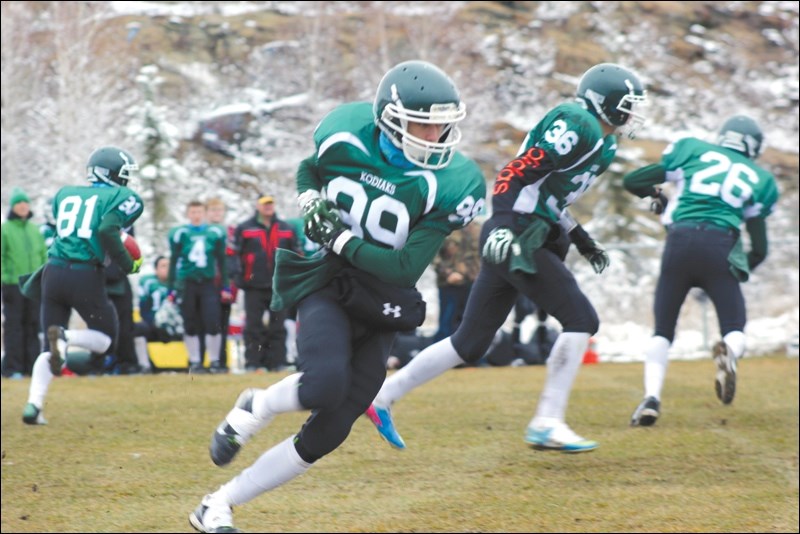 Outside linebacker Jordan Schanowski faked a run with the ball against the Cumberland House Islanders.