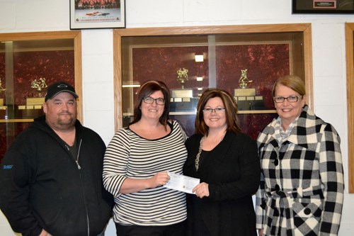 (l-r) Carlyle Sports Arena president Jeff Humphries and CSA secretary Tallie Baker accept a cheque for $5,000 from Carlyle's Homespun Commitee from Nicole Currie, Chairperson of the Carlyle Homespun Committee, and Judy Riddell, one of Homespun's founders. Baker says the money will be used toward renovating the rink's washrooms to make them wheelchair-accessible. “We have the lift,” says Baker, “But we still need to make both the men's and women's washrooms wheelchair-accessible. We are very grateful to Homespun.” Baker says the CSA committee welcomes donations towards this worthy project. To contribute, please contact any member of the rink committee for more information.