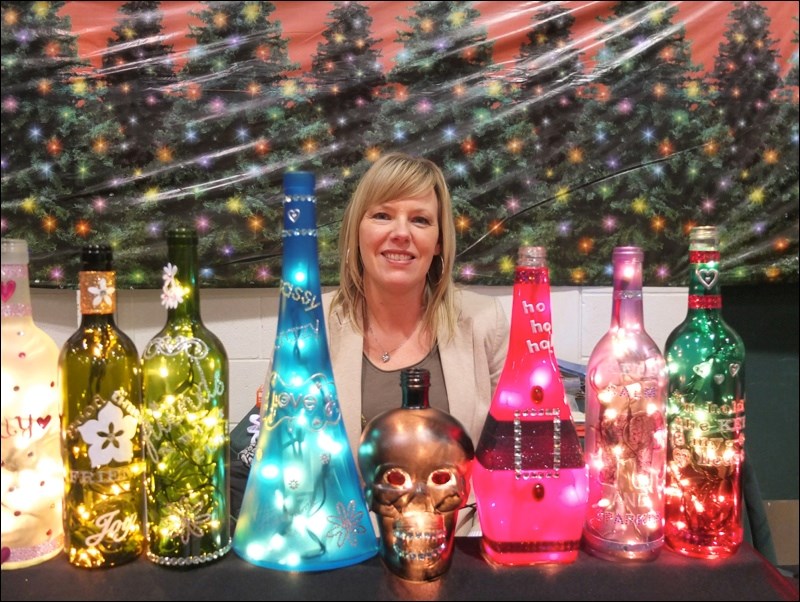 Tina Tait had bottle lamps for sale at the Festival of Trees, held at Creighton Community School over the weekend.
