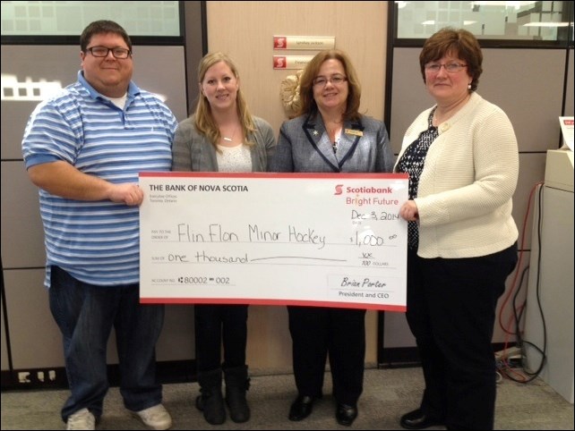 Flin Flon’s Scotiabank branch donated $1,000 to the Flin Flon Minor Hockey Association last week. From left: association president Travis Rideout and volunteer coordinator Carrie Stinton accepted the gift from the bank’s Charlyn Antoniw and manager Judy Schmidt. The donation will go toward ice dividers for the Whitney Forum as part of Hockey Manitoba’s Long Term Player Development program. Also contributing funds for the ice dividers was Flin Flon’s Operation Red Nose program.