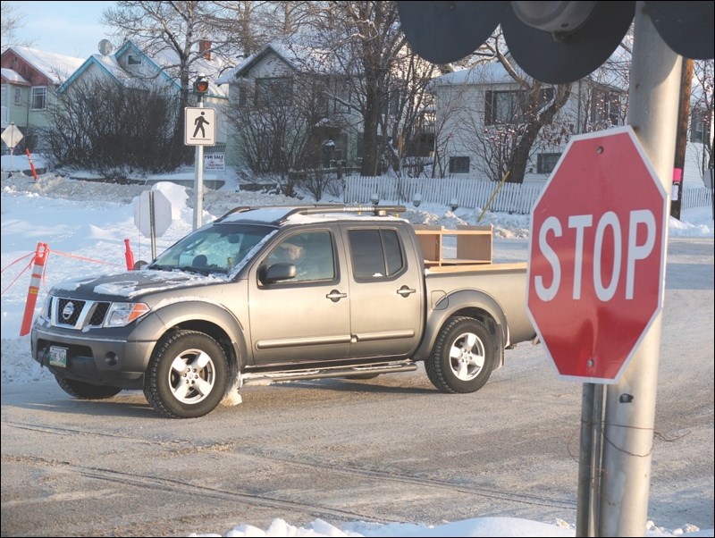 Stop sign at rail crossing