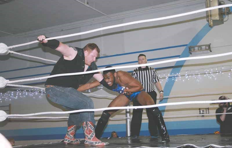 Alexander Prime tries to swing Jacob Creed unto the far ropes.