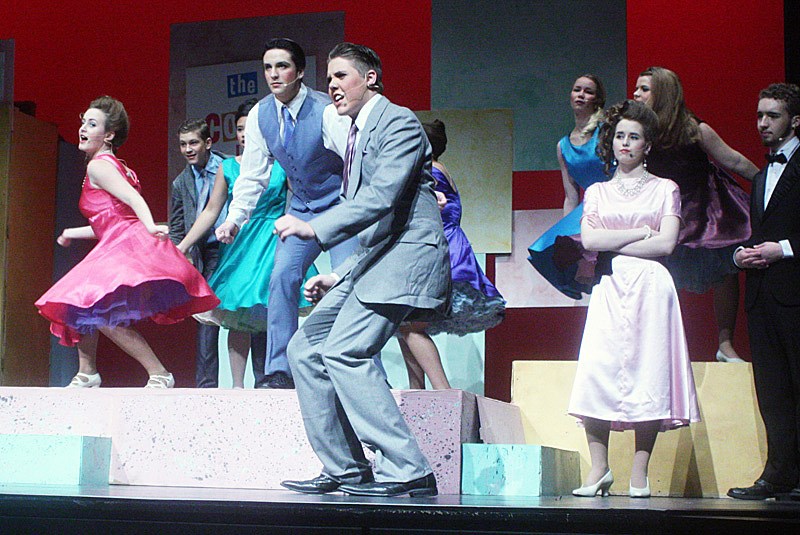 Corny Collins, front, played by Luc Gendreau, and the company perform “The Nicest Kids in Town.”