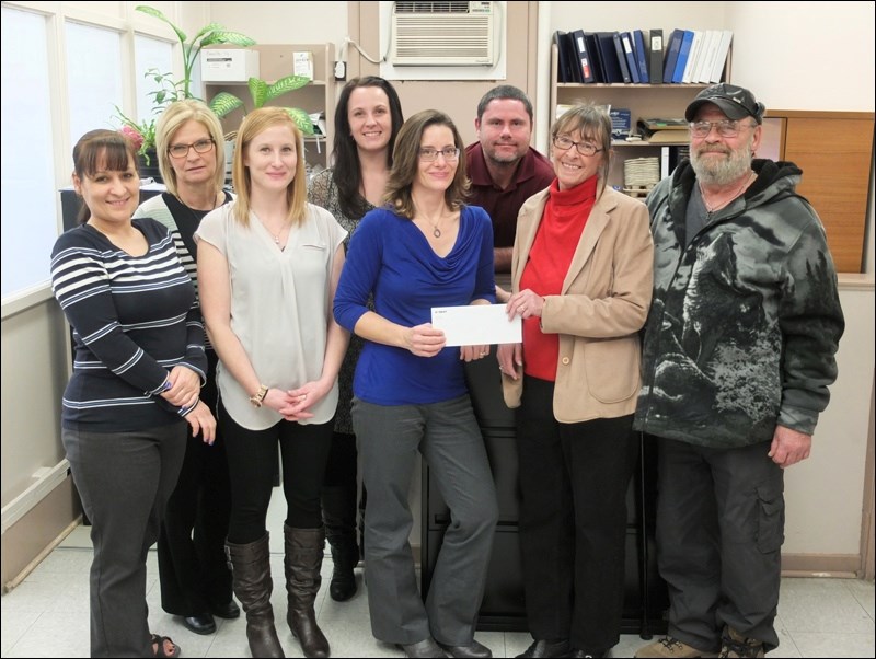 Hudbay gave an early Christmas present to residents in need by donating $2,250 to the Lord’s Bounty Food Bank last week. Presenting the donation on behalf of the company were, from left, human resources employees Jennifer Brooks, Kathy Crone, Lyndsay Lenderbeck, Carla Simon, Brenda Niedermaier and Terry Lawrence, to the food bank’s Carol and Dennis Hydamaka. Hudbay has long made an annual holiday donation of $2,000 to the food bank, but this year’s cheque was increased in recognition of inflation. The number of food bank clients is up slightly from this time last year.