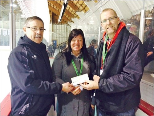 Gerald Hauta, general manager of Unity Credit Union, flanked by Delta Co-op Home Centre manager Peter Keller and committee members drew the lucky winner of the 50/50 pot of just over $2,500 at the World Junior A Hockey Challenge event in Unity Dec. 12th. Both Delta Co-op and Unity Credit Union were the main sponsors for the 50/50 jackpot that night.
