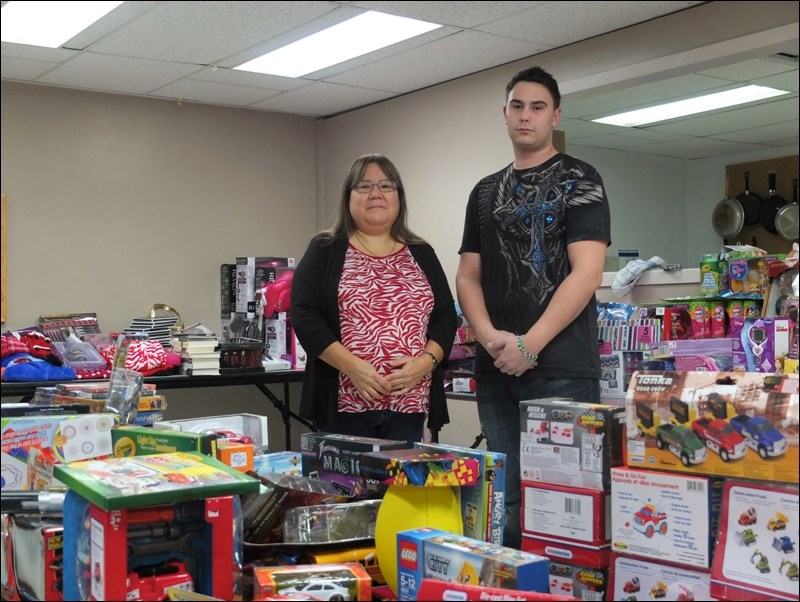 Virginia Gardiner and Jeremiah Herrmann of the Friendship Centre pose with some of the hundreds of toys that have been donated to the centre’s Christmas gift program. Parents in need began visiting the centre on Monday to select a gift for each of their children under the age of 18. As of Monday, the centre planned to help nearly 300 children, but registrations for next week are still being accepted. Combined, the toys are worth thousands of dollars.