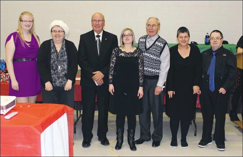The Saskatchewan Abilities Council would like to thank the Yorkton Lion’s Club for donating $1500 to the Annual Participant Christmas Party. This year the Day Program participants, their family members, staff and volunteers enjoyed a delicious meal, Long Service Awards, and a dance. Pictured above from left to right is Miranda Wood-Sparrow, Community Program Coordinator; Maryann Yachyshyn; Al Konkin, Lion’s Club Member; Stacey Pasloski; Peter Legebokoff, Lion’s Club Member; Caroline Harbuz; Jeff Langley.
