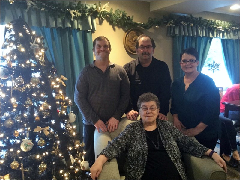 Long-time Flin Flonner Doris Bilitski celebrated her 80th birthday last weekend with sons Edwin (back, from left) and Rod, and daughter Maureen McKay on hand. Born in Flin Flon, Bilitski once lived in a wooden cabin where Stittco Energy Ltd. now stands. As a newborn, she was brought home from the hospital by dog sled. She marked her birthday at the Hemlock Drive Senior's Apartments, where she now resides. Unable to attend was son Kevin, who lives in BC.