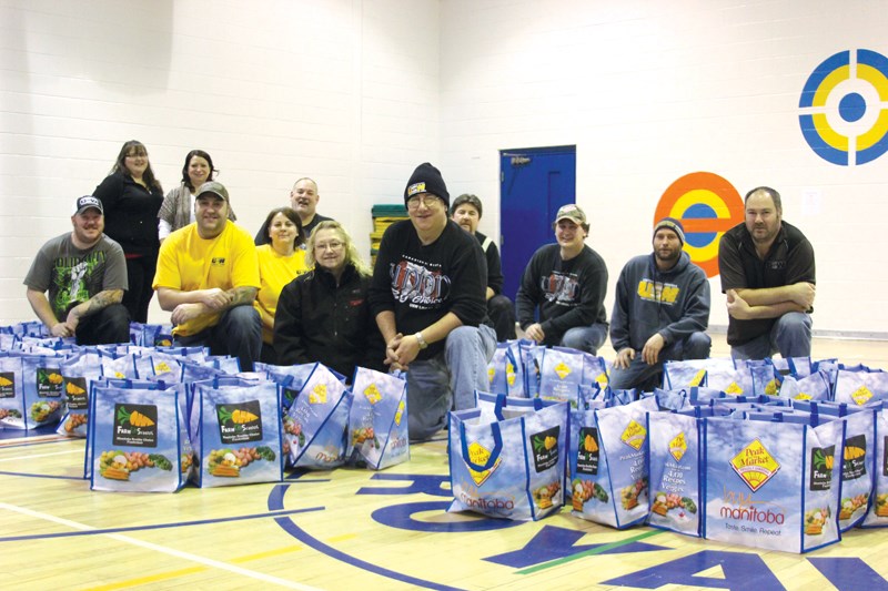 Ruth Betts Community School pulled through for the Lord’s Bounty Food Bank this holiday season with their Farm to School fundraiser. Students, parents and teachers sold over 200 grocery bags of fresh produce through the Farm to School fundraiser. The school donated just shy of 70 bags of fresh produce – including carrots and potatoes – to the Lord’s Bounty Food Bank with the help of the United Steelworkers Local 7106 volunteers. Pictured with the bags of food are school and union representatives, including Ruth Betts community connector Larace Osika (back, second from left) and union president Tom Davie (far right).