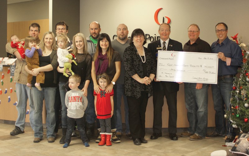 The Cugnet family, in partnership with Crescent Point Energy, donated $185,000 to the community of Weyburn on behalf of Ken Cugnet.

Pictured, (l-r) Tim Cugnet, holding son George, Matthew Cugnet with wife Jennifer holding daughter, Josephine, Craig Cugnet, Leyna Cugnet holding daughter Kensington and son Kingston (standing), Dan Cugnet with wife Tana and daughter Isabelle, Joanne Bannatyne Cugnet, Royal Canadian Legion Weyburn Branch #47 past president Brian Glass accepting a $40,000 cheque from Crescent Point Energy representatives Tim Lequyere and Dale Rinas. Missing from photo is grandson David Cugnet.