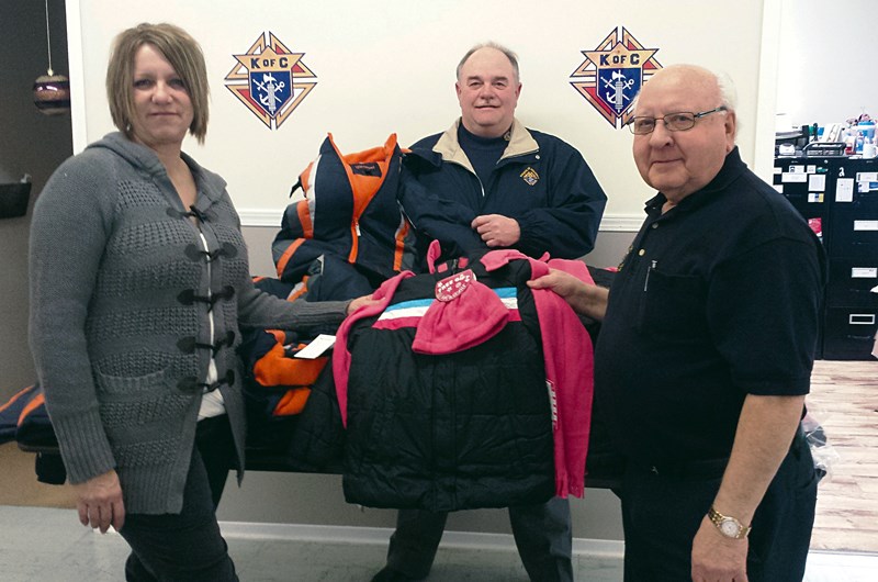 From right, Steve Popowich, grand knight and Terry Ruf, Knights of Columbus council member donate coats to Lois Okrainec, program manager for Kids First. The Knights have partnered with Geroy Simon’s Coats 4 Kids to collect the thousands of coats needed to keep Saskatchewan’s less fortunate children. Last week’s donation to Kids first came from the local Knights’ council fundraising efforts. Okrainec was delighted to accept the coats on behalf of the 121 families her organization services in Yorkton.