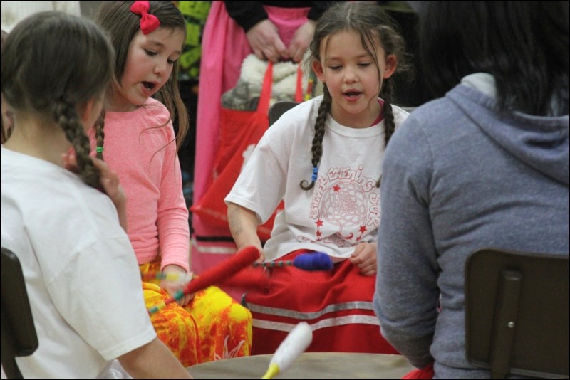 Grace Little (left) and Meeka Dean-Asmus were two drummers from Silver Evening Star Singers playing at CADAC’s First Night Out celebration to help bring in 2015.