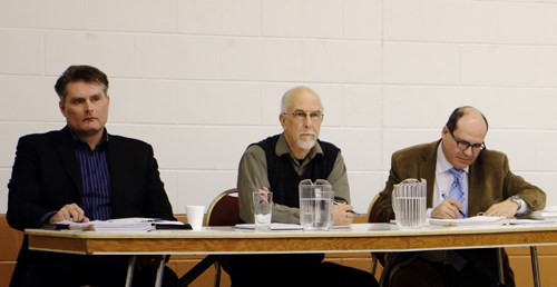 The Heritage Property Review Board members, Royce Pettyjohn, Philip Hamm, and Claude-Jean Harel, listened to presentations for and against having the building made into a heritage site.