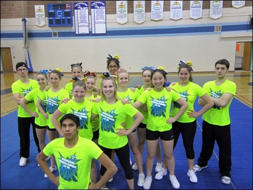 The John Paul II Collegiate cheer team members are Isaiah Bailey, Courtney Baker, Lauren Warneke, Jensen Foulston, Michaela Newman, Reena Manegre, Berklee Crockett, Jodi Thomas, Dayne Bunz, Jennifer Ross, Emma Niu, Alexis Mak, Brady Finch and Viper Thomas in front. Photos submitted