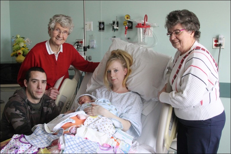 Blake Emmit Webber was the second baby born at the Flin Flon General Hospital in 2015 – just a few hours after the first baby of the year. Parents Ashley Hansen and Dustin Webber of Flin Flon accepted gifts from the North Star Rebekah Lodge, presented by Eileen Jessup (left) and Amy Ruckle. Blake was born Jan. 7 at 8:46 pm weighing seven pounds seven ounces and measuring 20.74 inches long. The first baby of the year, Rayne Ballantyne, was born to Candace Ballantyne and Ryan Sewap of Deschambault Lake. The couple and their son will receive an assortment of gifts from local merchants.