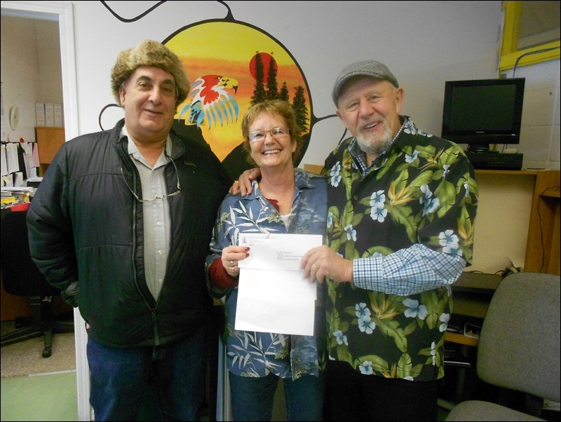 Flin Flon MLA Clarence Pettersen (right) last month presented $55,000 to the LUD of Cranberry Portage for its beach development project. The funding came through the province’s Community Places program. Accepting the grant were councillors Larry Johnson and Debbie McLauchlan.