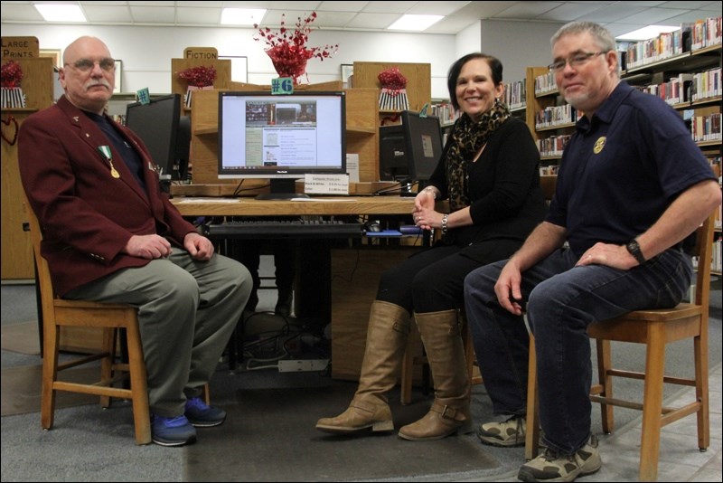 On behalf of the Flin Flon Public Library, administrator Cindy McLean recently accepted a donation of six new computers from Flin Flon Rotary Club president Bill Pauley (right) and Lions Club member Allan French. In 2014 alone, the library had just shy of 4,500 logins on its six older computers. McLean reached out to clubs across the community to help with the cost of new computers and received $3,000 from the Rotarians and $2,000 from the Lions.