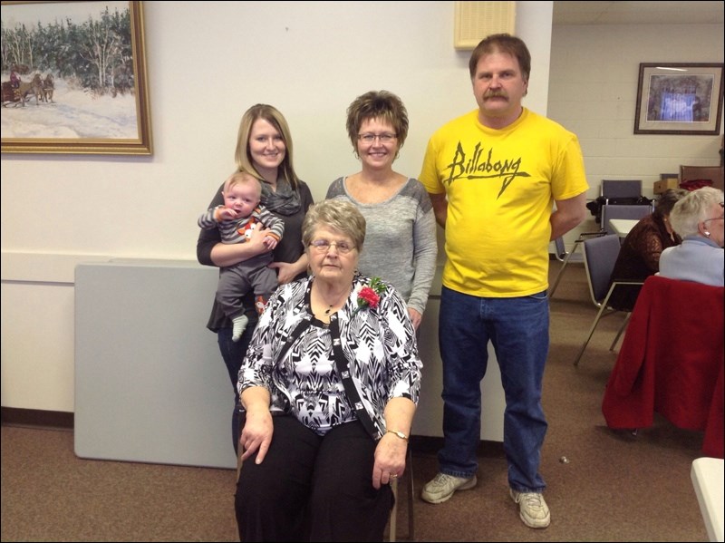 Family and friends helped Lena Kopachinski celebrate her 80th birthday on Jan. 17. Pictured here are Lena, granddaughter Holly Perkins and great grandson Odin Leefe, daughter-in-law Kandi Kopachinski and son Wayne Kopachinski.