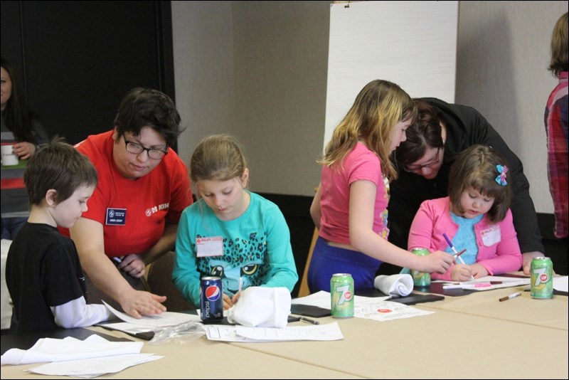 Flin Flon Kinette Amber Jessup helped lead a new initiative to get children involved in service projects for the community. Kin Kids had their first meeting earlier this month to discuss fundraising ideas as well as ways to be helpful in the community. The group, which had 18 children at the first meeting, will meet monthly at the Victoria Inn Hotel and Convention Centre.