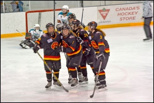 The Regina Rebels celebrate Jordyn Miller's goal during an eventual 4-3 win Sunday.