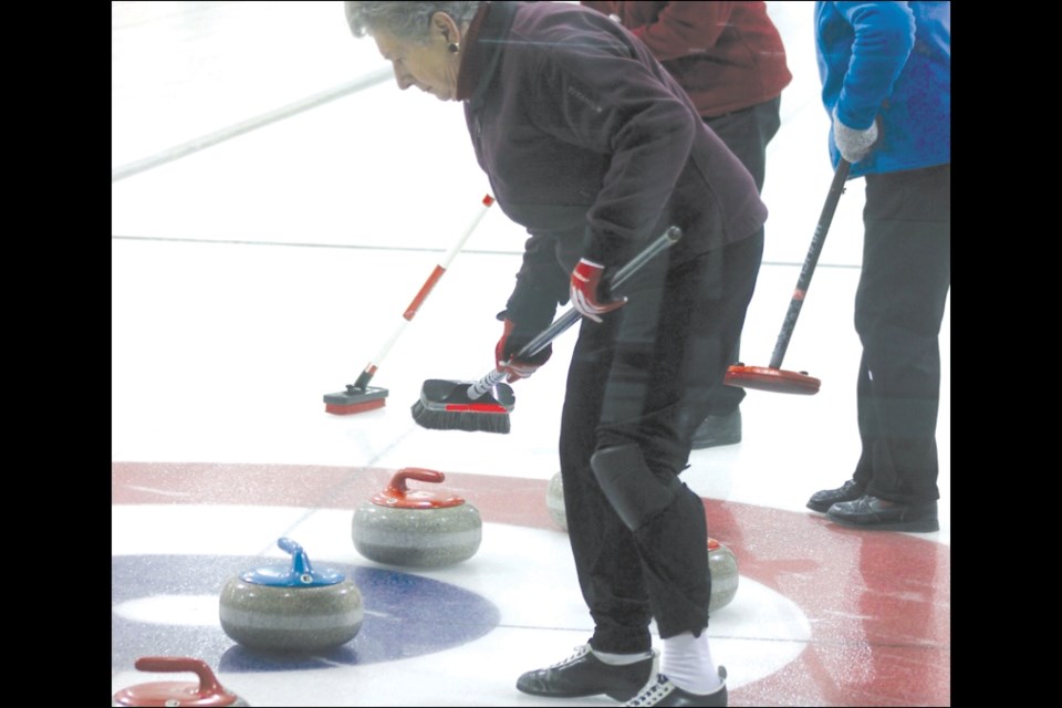 Skip Evelyn Meyer kept a close eye on the rock during the finals. Meyer is joined by Second Yvonne Davis and Lead Doreen Gabler.