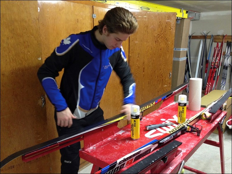 Nick Martin cleans his skis before a Saturday afternoon practice.