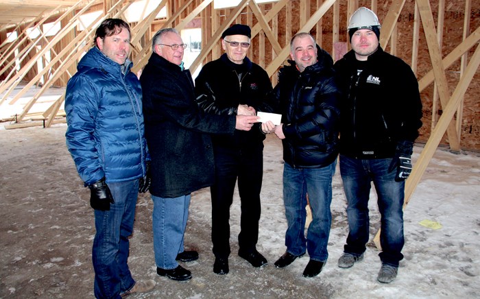 Yorkton Co-op is making a major contribution to the Community Clubhouse at Century Field. They are donating $50,000 to the project, and will see the home team’s changing room named the Co-op Home Team Room. Pictured above are (l-r) Jason Farrell with Yorkton Minor Football, David Polachek, Yorkton Co-op board Vice-President, Gene Krepakevich, Yorkton Co-op board President, Roby Sharpe with Yorkton Minor Football and Dustin Nehring with NL Construction. Krepakevich says it was an easy decision to support the project, as they believe minor sports develop young people and a project like this was needed for the local sports programs. He says he is impressed with the size of the building and believes it will meet the needs of local teams for years to come.