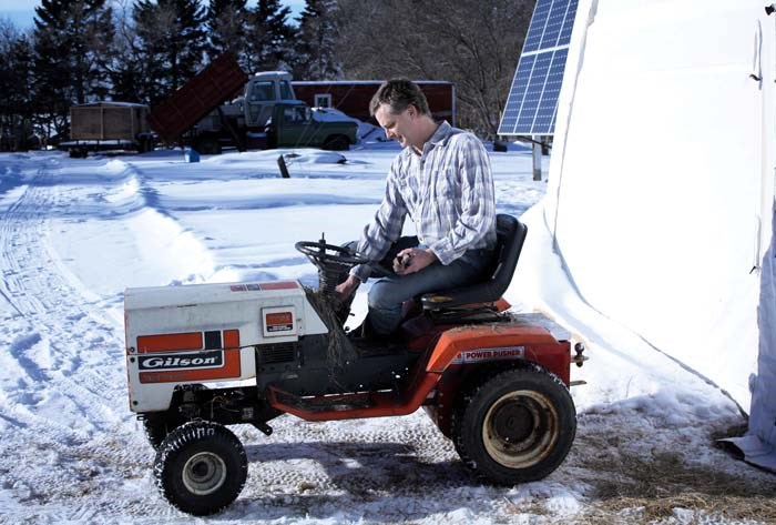 Brian shows off his fully electric garden tractor, which he converted to take advantage of extra power generation in the summer. He says it now has even better traction with the weight concentrated over the back wheels.