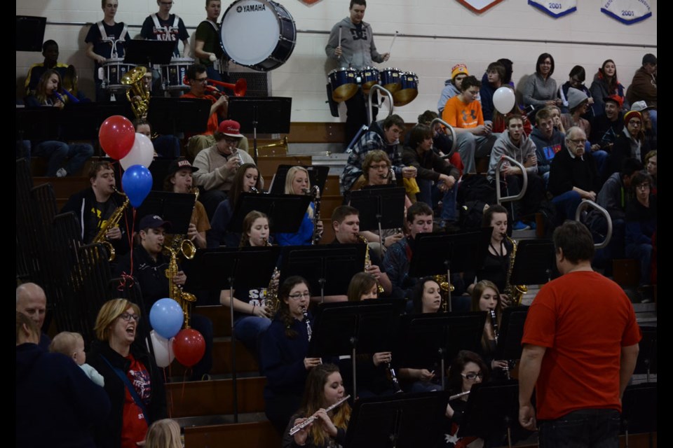 The ECS school band played familiar tunes during breaks in the action.
