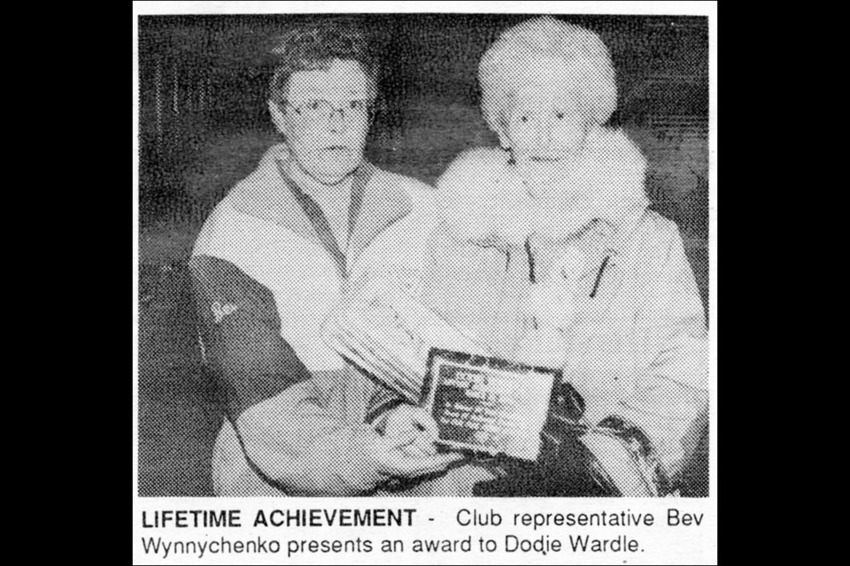 Dodie Wardle (right) received a lifetime achievement award from club representative Bev Wynnychenko in the 1990s.