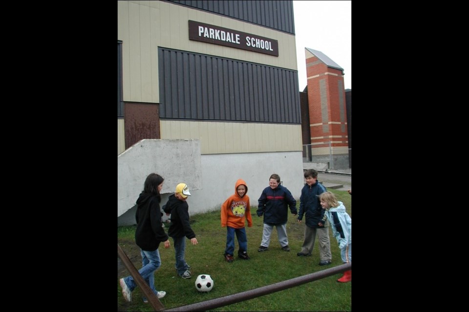Children play outside Parkdale School on June 24, 2005, the last day of regular classes at the school.
