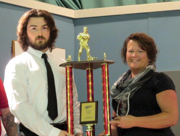 Minard’s Leisure World representative, Judy Lumb, presented Josh Cronin with the Weyburn Red Wing Most Valuable Defenceman award at the annual awards banquet on March 2.
