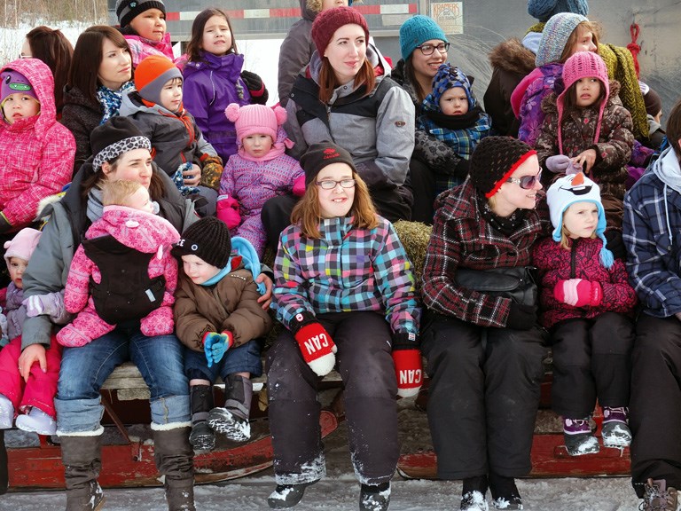 Festival participants enjoy a horse-drawn wagon ride.