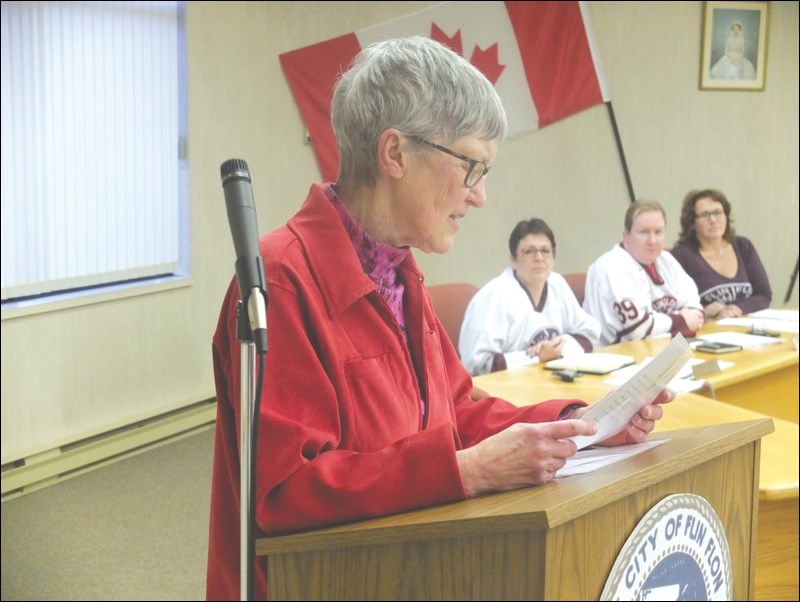 Sheila Marchant read poetry to open last week’s Flin Flon city council meeting. It was part of the Mayor’s Poetry City Challenge, issued across Canada by Calgary Mayor Naheed Nenshi. In the background are councillors Leslie Beck (from left), Tim Babcock and Colleen McKee.