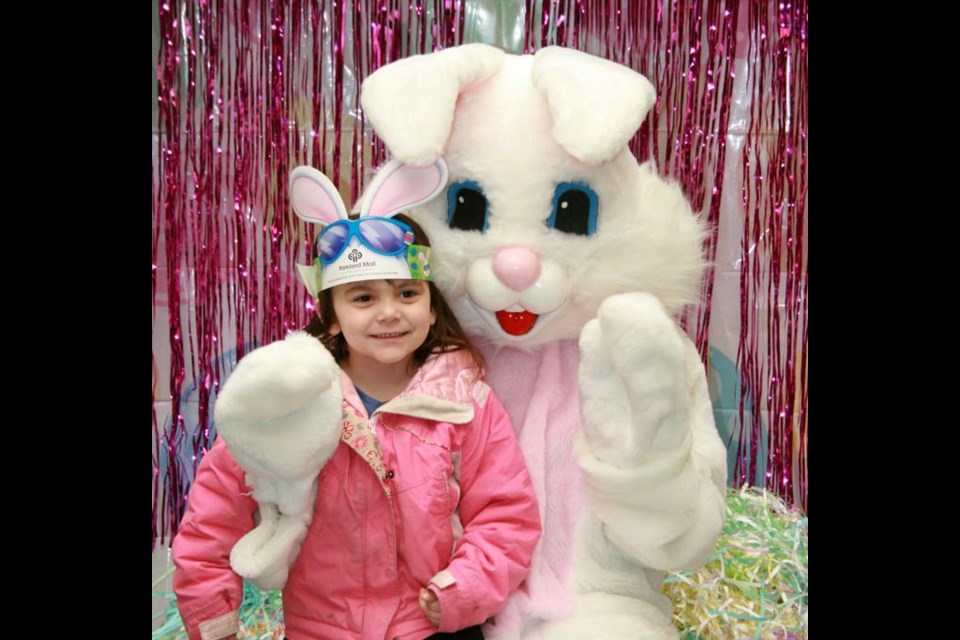 The Easter Bunny stopped by the Parkland Mall in Yorkton Saturday to greet children who lined up to have their picture taken with the seasonal visitors. Here Juliet Tomlinson of Churchbridge has her time with the famed bunny. Helpers also handed out chocolate eggs to the children too, creating more smiles for those stopping by to see the popular rabbit.