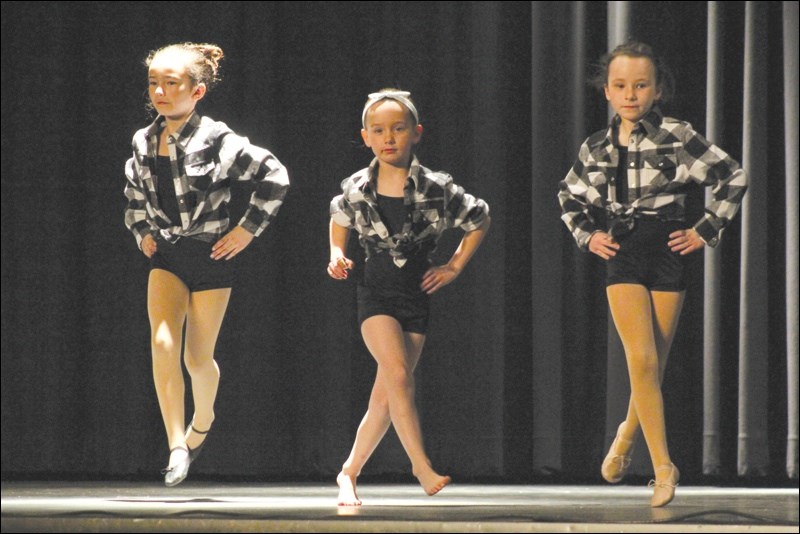 Emma White, Neveya Simard and Aaliayah Kerfont danced to Footloose in the 7/8 group.