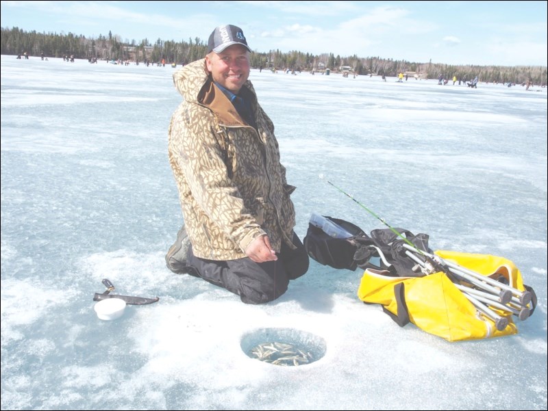 Creighton’s Jodi Suski reeled in a 66-centimeter burbot, one of nine fish caught at the Flinty Fishing Derby on Sunday.