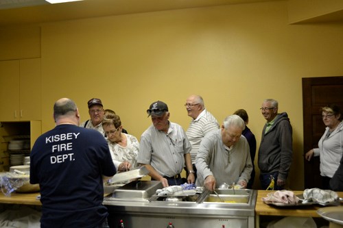 Kisbey's Volunteer Fire Department hosted a steak supper fundraiser, cooked by the firefighters on Friday, April 10 at the Kisbey Rec Centre. The firefighters are raising funds towards the purchase of specialized equipment for the deprtment's side by side. Here, fire chief Rob Cobb serves supporters.