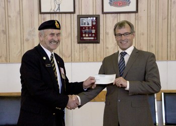 The Royal Canadian Legion Branch No. 77 has made a major contribution to the Health Foundation’s campaign to buy vital signs monitors, with $5,000 going to the much needed equipment. Pictured above, Legion President Peter Wyatt presents Ross Fisher, Executive Director of the Health Foundation with the cheque. The Legion has been a long-time supporter of the Health Foundation through the Poppy Campaign, and Wyatt says that their long time support is because the health region takes good care of the local veterans, especially as they get older, so this is a way to both give to the community at large and support local veterans. Fisher thanks the Legion for their many years of support, and says that a contributor like the Legion is something that can help them get momentum on larger projects and continue improving care in the region. So far, the Legion has donated $26,000 to different organizations through the 2014 Poppy Campaign, which was $3,500 up over previous years.