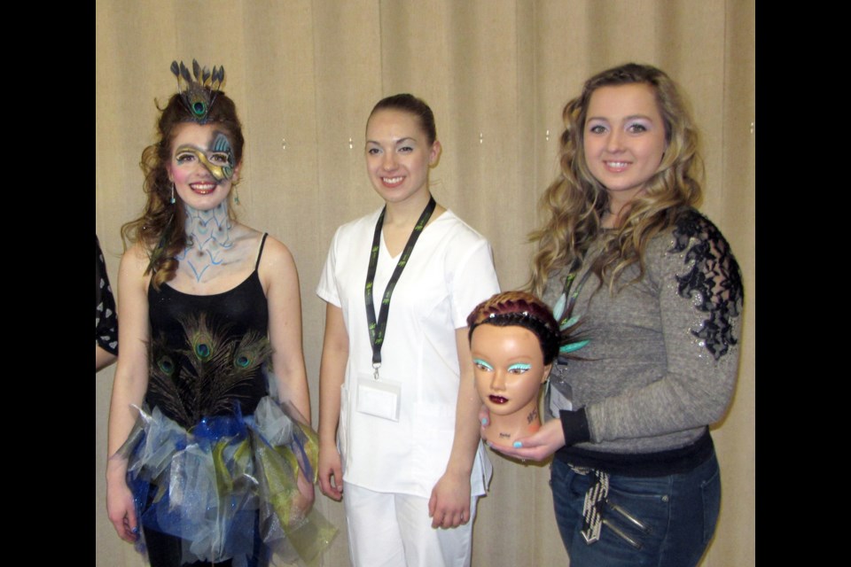 Cosmo Golds (left to right), Allison Lucyk (model), displays Aesthetics gold medalists work; Sarah Kushniruk (Aesthetics Gold) and Paige Swan (Hairstyling, Braiding, Gold)