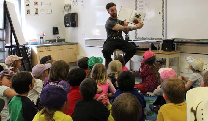 Canadian Wrestling’s Elite took centre stage last Wednesday night with their fast paced, hard hitting, action packed show, but before that several wrestlers showed their softer side. Carter Mason (shown here), ‘A-List’ Anderson Tyson Moore and Jason ‘The Gift’ Kincaid all read books to the young Yorkdale students. (See related Sports story)