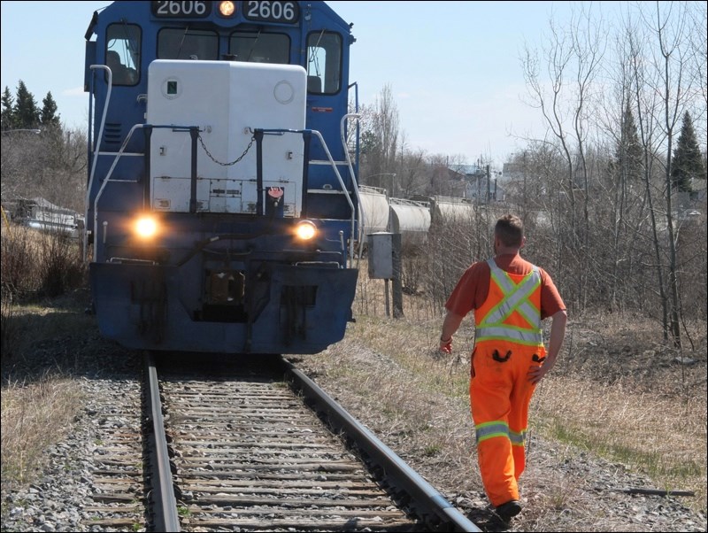 The train’s engineer heads back to his locomotive after meeting with IAM.