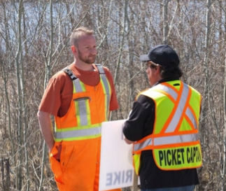 The engineer of a Hudbay-bound train speaks with IAM's Rene Beauchamp at about 3 pm Wednesday.