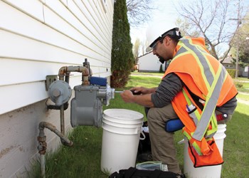 Over the next five weeks, SaskEnergy and Grid One Solutions will be upgrading the city’s gas meters to include a wireless module for remote meter reads, part of SaskEnergy’s Advance Metering Infrastructure plans. The goal of the project is to have actual gas reads on every bill as well as no longer requiring physical meter checking. Pictured above, Nathan Brown installs a meter at a residence on King Street.