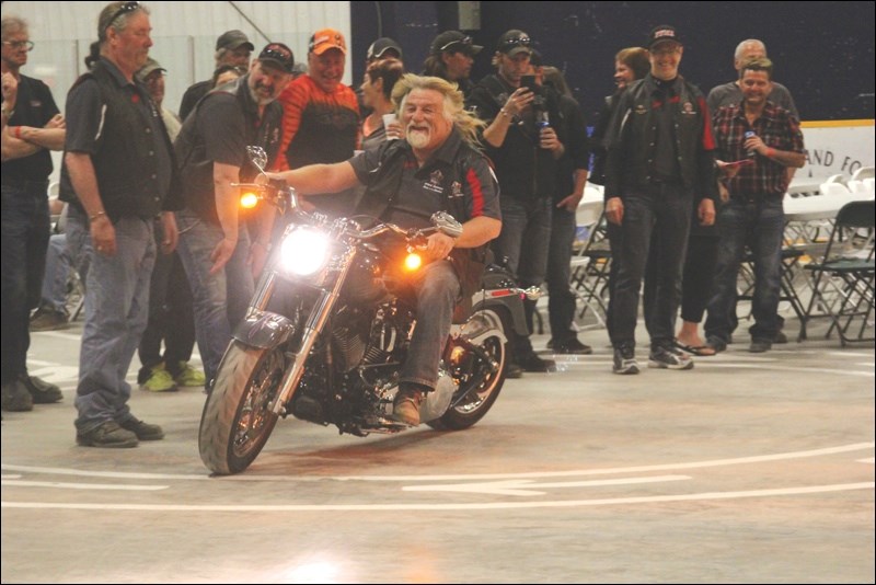 Bentley Busby of the Flin Flon Motorcycle Association took a 2015 Harley Davidson Fat Boy for a spin around the Creighton Sportex shortly before the bike was raffled off last Saturday night, May 23. Aaron Dowding (not pictured) was the lucky winner of the bike. For more on the Motorcycle Association’s Run to the Border, please see pg. 11.