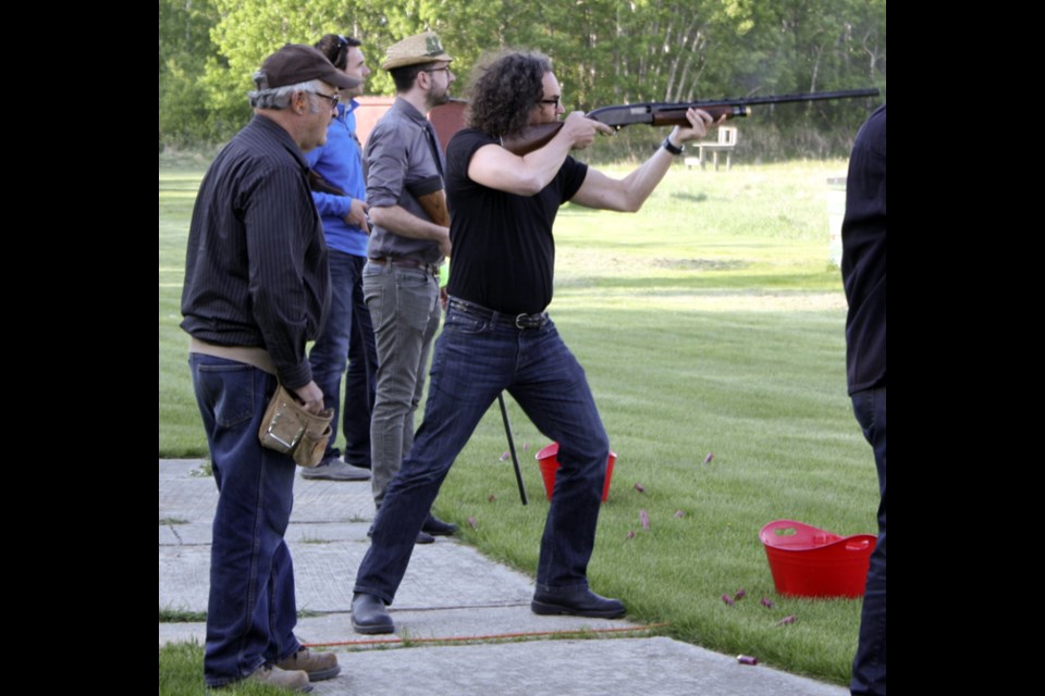 Cross tries his hand at skeet shooting during the Lions LobsterFest Friday evening.