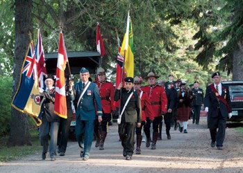 The Royal Canadian Legion paraded into the city cemetery Saturday evening to conduct the annual Decoration Day Ceremony. In traditional fashion, the scattering of ashes was carried out by cadets. A new presentation this year showed hand-crocheted poppies placed into a vase with sand from the beaches of Normandy brought overseas as a sign of respect for Canadian veterans. After the ceremony, the parade was led back to the Legion Hall for refreshments.